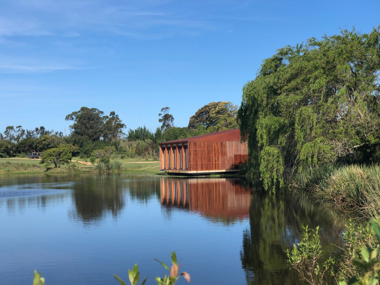 The Las Musas pavilion reflected in the lagoon