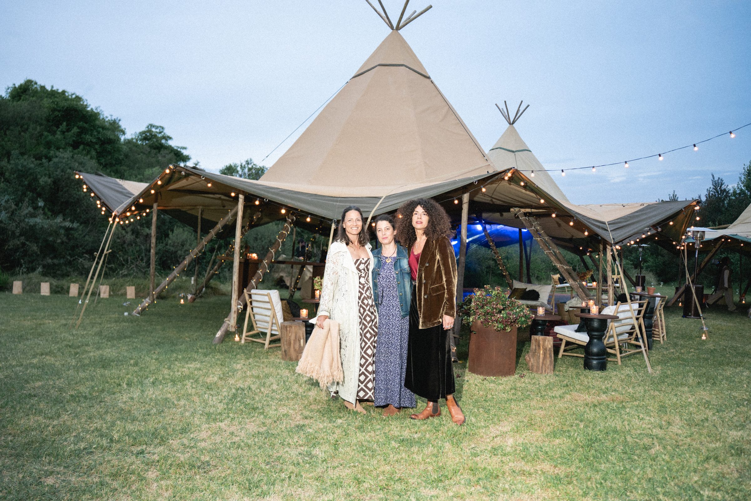 The INTRO team in front of the tipis at a private event